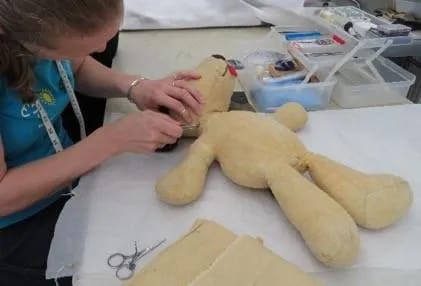 Well-loved soft toy during conservation treatment