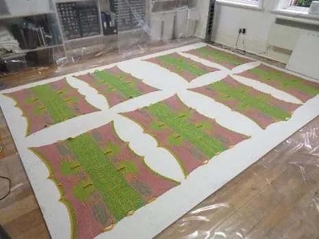 Carpet sculpture with severe moth infestation